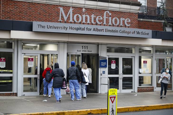 Medical workers enter Montefiore Medical Center during the coronavirus pandemic, April 24, 2020